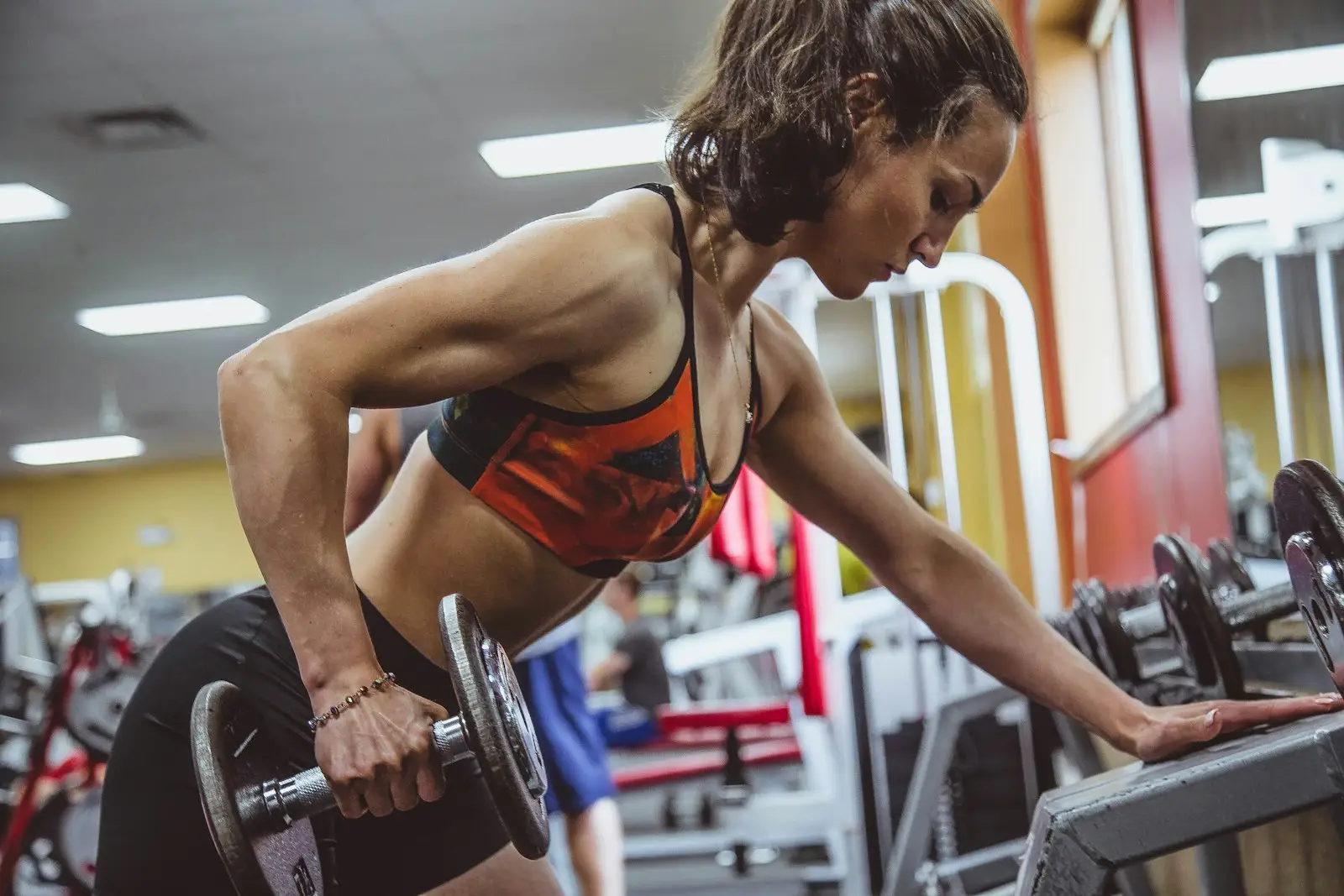 Woman training with dumbbells