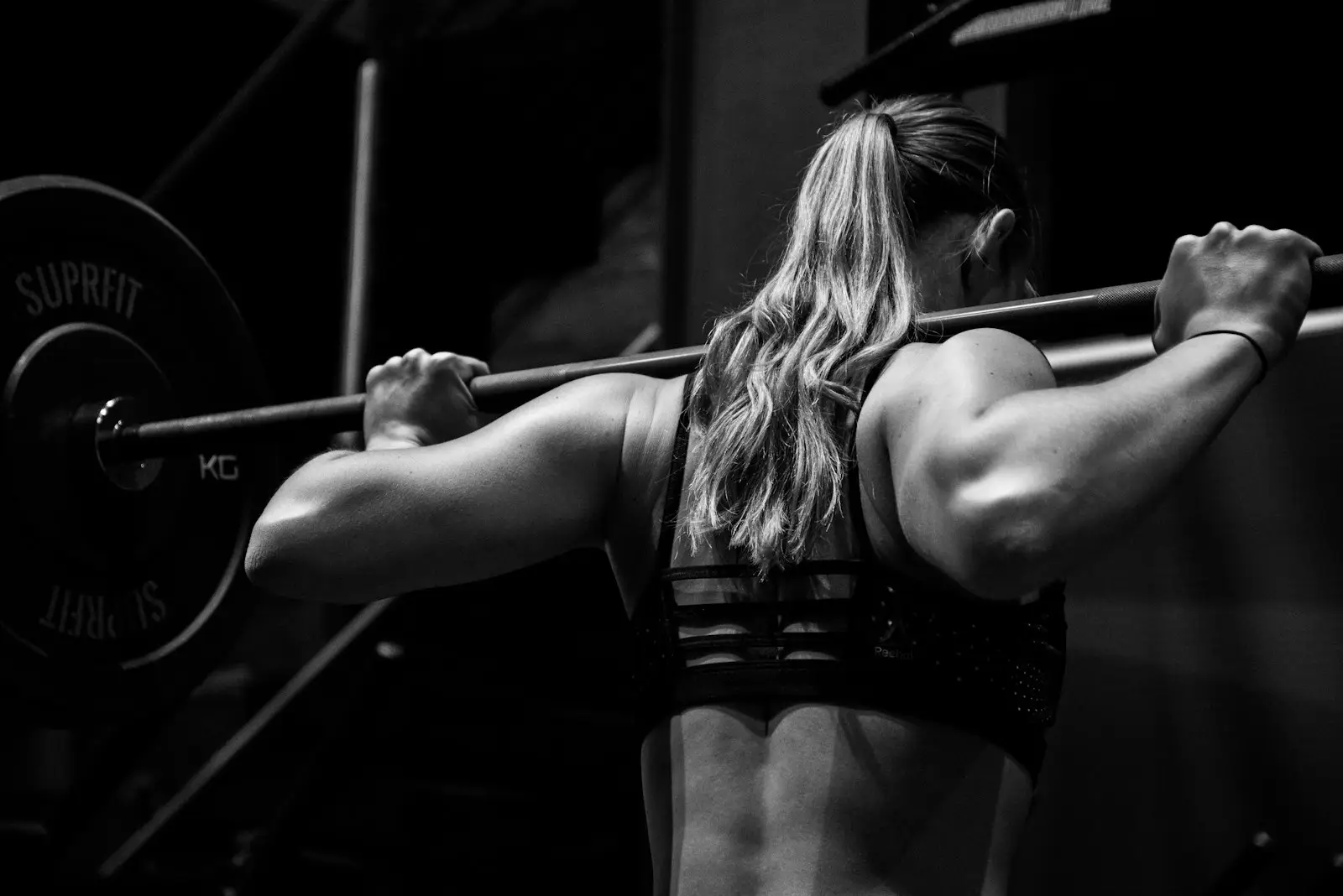 Woman preparing for a barbell squat