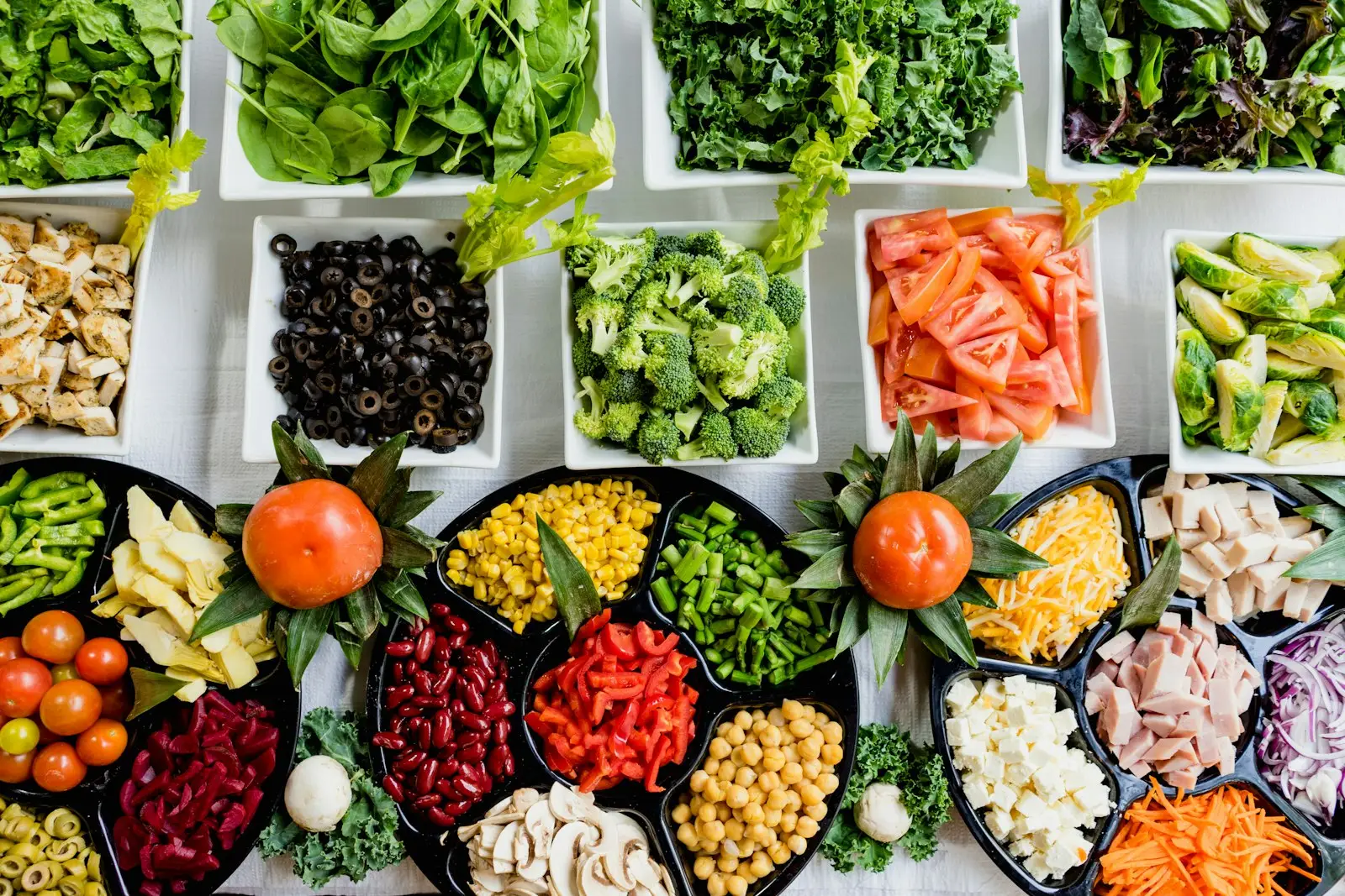Meal prep containers filled with colourful vegetables and grains